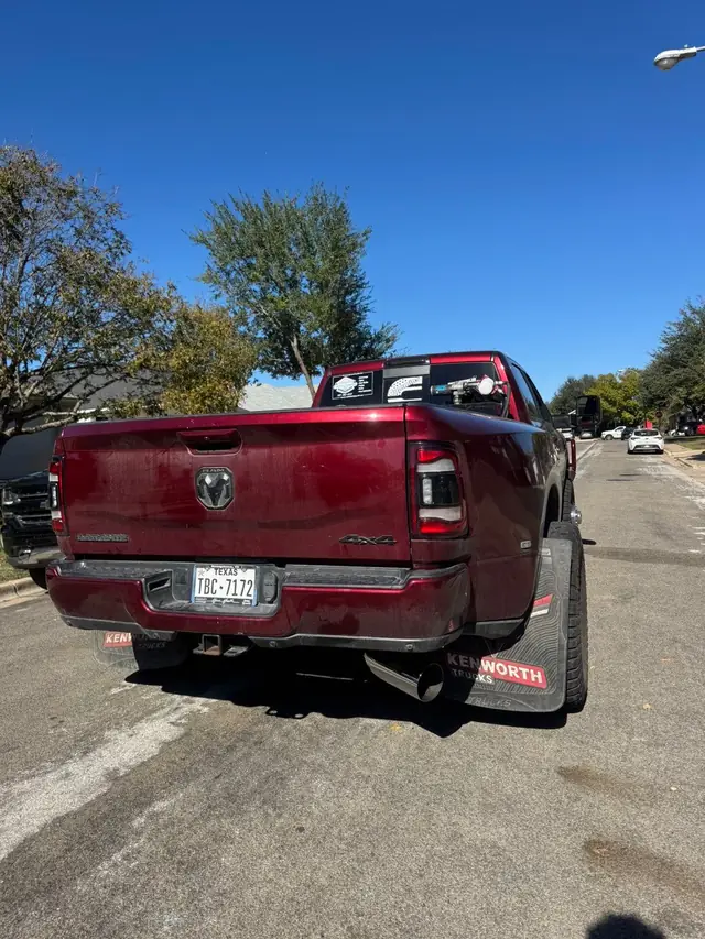 Red Ram pickup parked on the street, seen from the rear