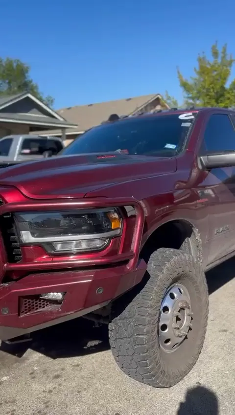 Red Ram dually pickup parked on a residential street
