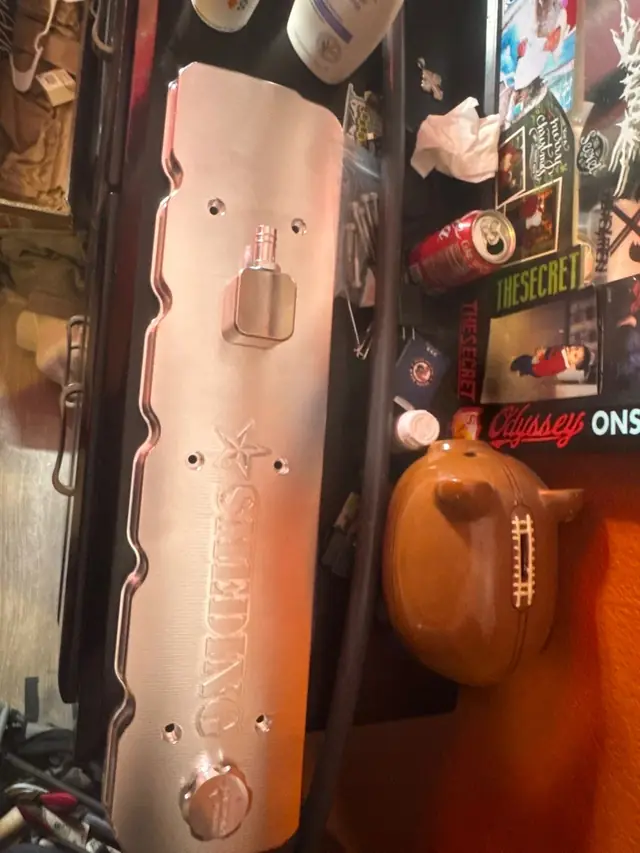 Polished aluminum valve cover in the shop