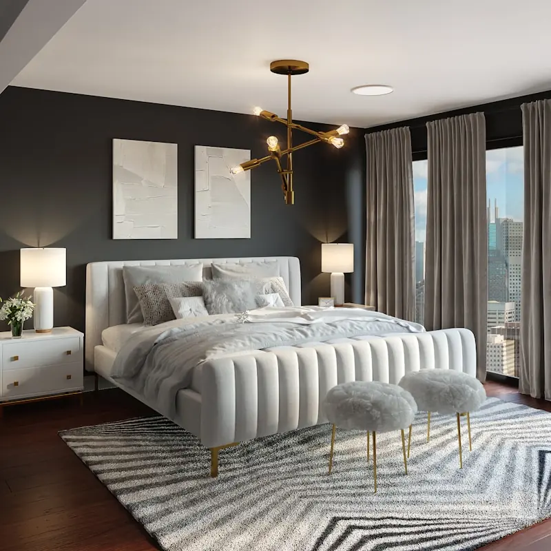 Dormitorio con cama tapizada blanca, alfombra geométrica y lámpara dorada